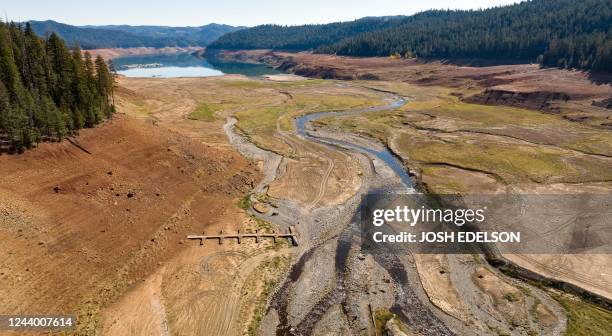 In this aerial picture taken on October 15, 2022 boat docks sit at the bottom of the Stuart Fork arm of Trinity Lake during an ongoing drought in...