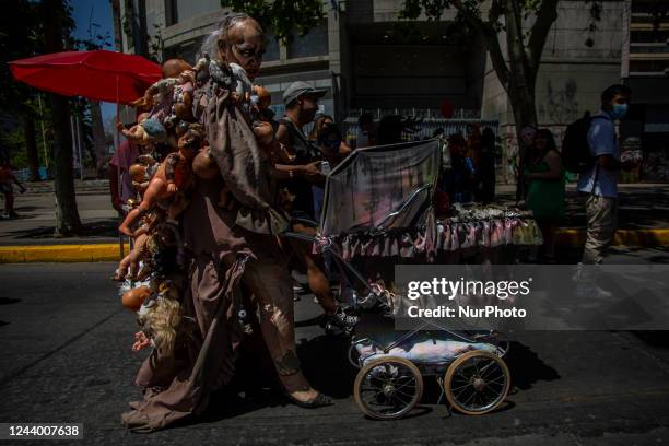 Person wears a horror costume occupying a lot of plastic babies and a vintage car. After three years of absence, zombies and horrible creatures once...