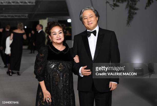 South Korean producer Miky Lee and South korean director Park Chan-wook arrive for the 2nd Annual Academy Museum Gala at the Academy Museum of Motion...