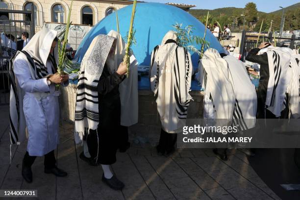 Ultra-Orthodox Jews gather at the gravesite of Rabbi Shimon Bar Yochai at Mount Meron in northern Israel, on October 16 as they celebrate the Hoshana...