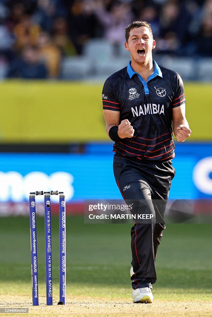 Namibia's JJ Smit celebrate the wicket of Sri Lanka's Chamika... News