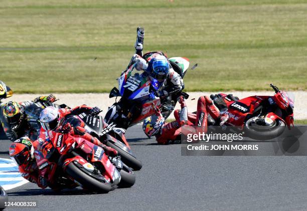 Ducati Lenovo's Australian rider Jack Miller crashes with LCR Honda Castrol's Spanish rider Alex Marquez during the MotoGP Australian Grand Prix at...