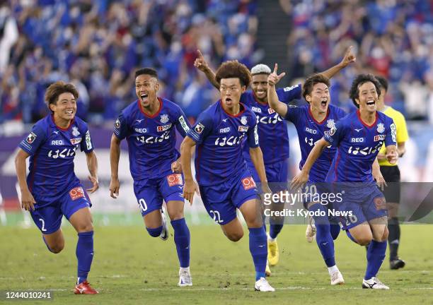 Ventforet Kofu players react after winning the Emperor's Cup football final against Sanfrecce Hiroshima on Oct. 16 at Nissan Stadium in Yokohama,...
