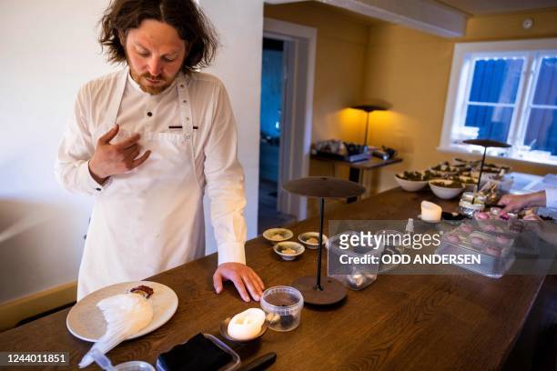 Double-Michelin-starred Faroese chef of KOKS restaurant Poul Andrias Ziska speaks as he prepares 'Ptarmigan and black currant salsa' served on a...