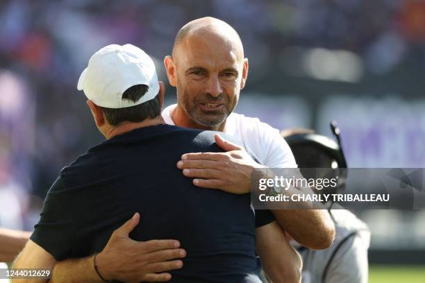 Toulouse's French head coach Philippe Montanier greets Angers' French head coach Gerald Baticle prior to the start of the French L1 football match...