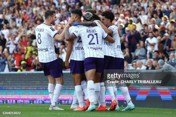Toulouse's Belgian midfielder Brecht Dejaegere celebrates with teammates after scoring a goal during the French L1 football match between Toulouse FC...