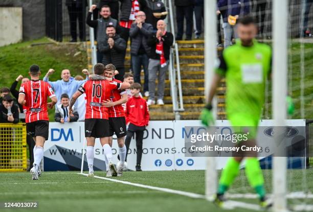 Derry , United Kingdom - 16 October 2022; Jamie McGonigle of Derry City, right, celebrates with teammate Patrick McEleney after scoring their side's...
