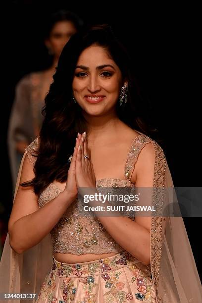 Bollywood actress Yami Gautam presents a creation by designers Shyamal and Bhumika during the FDCI X Lakme Fashion Week in Mumbai on October 16,...