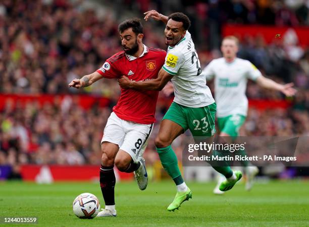 Manchester United's Bruno Fernandes battles with Newcastle United's Jacob Murphy during the Premier League match at Old Trafford, Manchester. Picture...