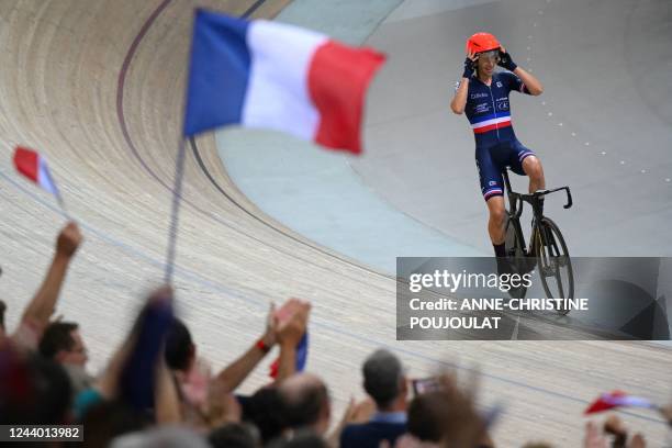 France's Benjamin Thomas celebrates winning the Men's Madison 50km final during the UCI Track Cycling World Championships at the Velodrome of...