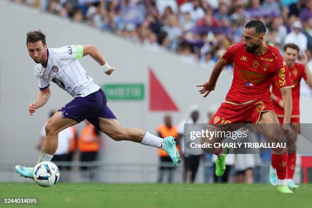 Toulouse's Belgian midfielder Brecht Dejaegere fights for the ball with Angers' French midfielder Himad Abdelli during the French L1 football match...