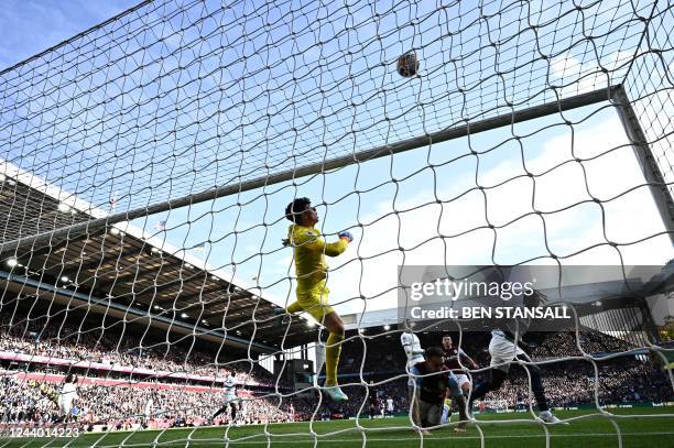 Chelsea's Spanish goalkeeper Kepa Arrizabalaga jumps to save the ball during the English Premier League football match between Aston Villa and...