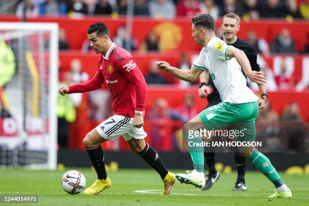 Manchester United's Portuguese striker Cristiano Ronaldo controls the ball during the English Premier League football match between Manchester United...