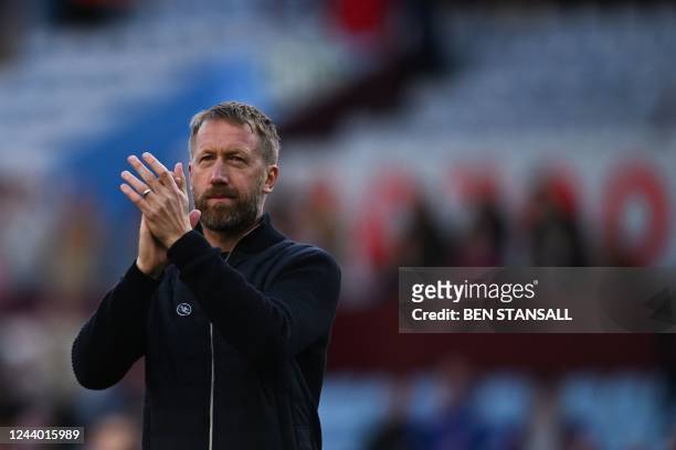 Chelsea's English head coach Graham Potter applauds at the end of the English Premier League football match between Aston Villa and Chelsea at Villa...
