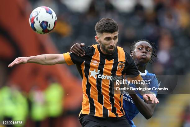 Hull City's Dogukan Sinik and Birmingham City's Emmanuel Longelo battle for the ball during the Sky Bet Championship match between Hull City and...