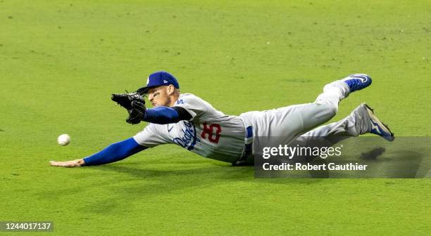 San Diego, CA, Saturday, October 15, 2022 -Los Angeles Dodgers center fielder Trayce Thompson dives for a liner hit by San Diego Padres center...