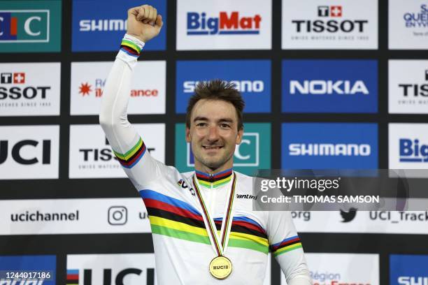 Italy's Elia Viviani celebrates his gold medal on the podium after winning the Men's Elimination finals during the UCI Track Cycling World...