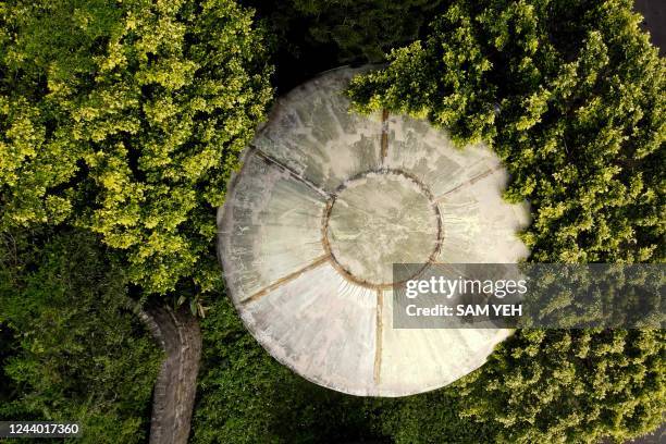 This aerial view picture taken on October 4, 2022 shows an abandoned unidentified flying object shaped house at the Feitsui beach, also as know as...