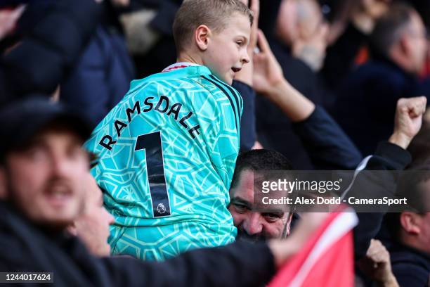 Young Arsenal fan gets Aaron Ramsdales shirt after the Premier League match between Leeds United and Arsenal FC at Elland Road on October 16, 2022 in...