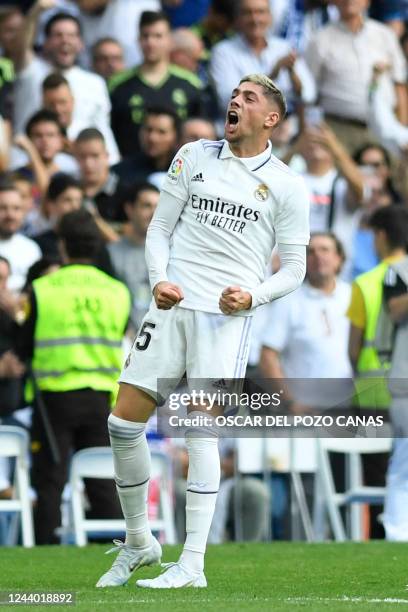 Real Madrid's Uruguayan midfielder Federico Valverde celebrates scoring his team's second goal during the Spanish League football match between Real...