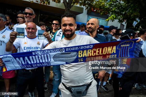 Real Madrid fan shows a scarf ahead of the derby match 'El Clasico' in the Santiago Bernabeu Stadium between Real Madrid and F.C. Barcelona teams.