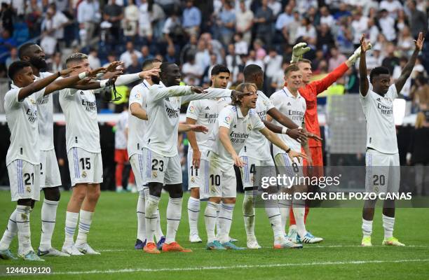 Real Madrid's players celebrate victory after the Spanish League football match between Real Madrid CF and FC Barcelona at the Santiago Bernabeu...