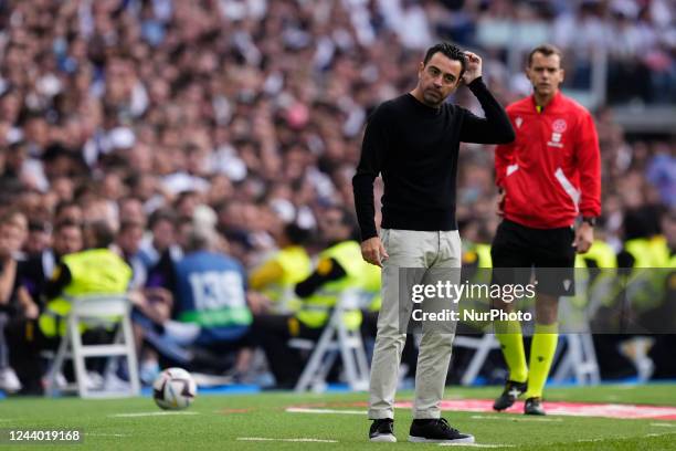 Xavi Hernandez head coach of Barcelona reacts during the La Liga Santander match between Real Madrid CF and FC Barcelona at Estadio Santiago Bernabeu...