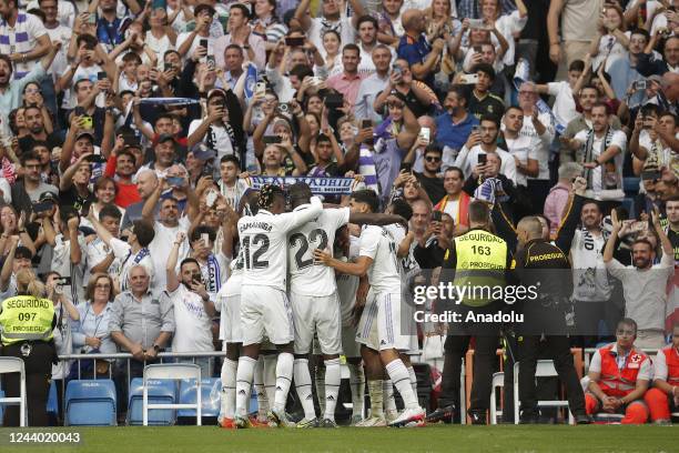 Rodrygo of Real Madrid celebrates with his team mates after scoring a goal during the La Liga Santander match between Real Madrid and Barcelona at...