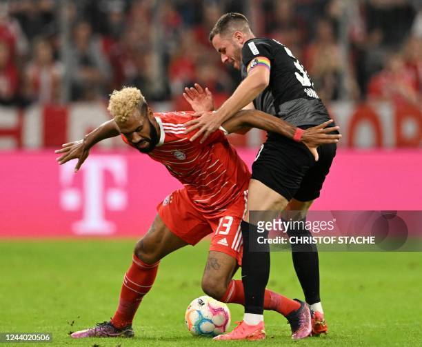 Bayern Munich's Cameroonian forward Eric Maxim Choupo-Moting and Freiburg's German defender Christian Guenter vie for the ball during the German...