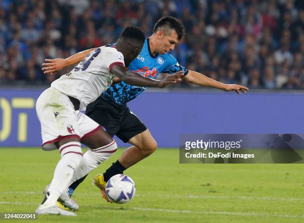 Hirving Lozano of SSC Napoli battle for the ball during the Serie A match between SSC Napoli and Bologna FC at Stadio Diego Armando Maradona on...