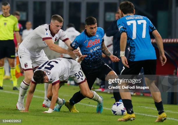 Mathias Olivera of SSC Napoli battle for the ball during the Serie A match between SSC Napoli and Bologna FC at Stadio Diego Armando Maradona on...