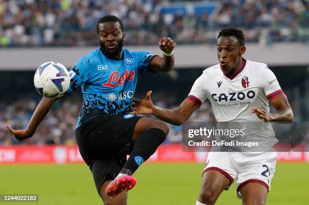 Tanguy Ndombele of SSC Napoli, Jhon Lucumi of Bologna FC 1909 battle for the ball during the Serie A match between SSC Napoli and Bologna FC at...