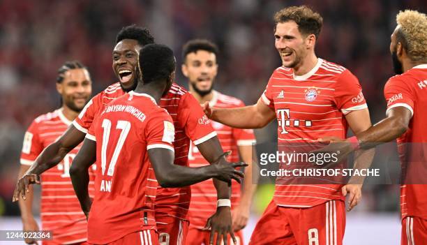 Bayern Munich's Senegalese forward Sadio Mane celebrates scoring the 4-0 goal with his team-mates during the German first division Bundesliga...