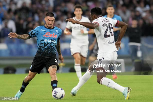 Matteo Politano of SSC Napoli competes for the ball with Jhon Lucumí of Bologna FC during the Serie A match between SSC Napoli and Bologna FC at...