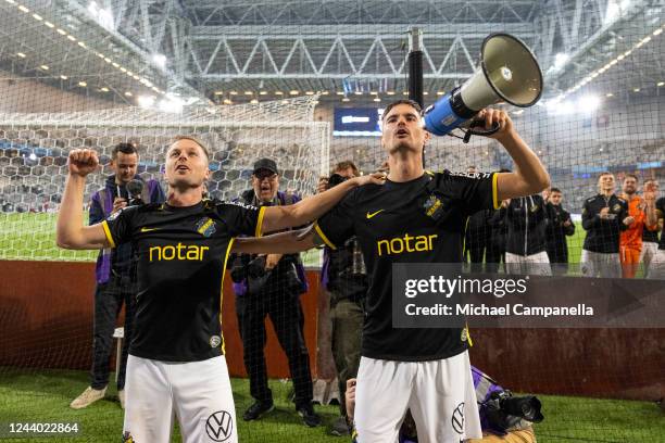 AIKs Sebastian Larsson and Mikael Lustig celebrate AIKs victory during an Allsvenskan match between Djurgardens IF and AIK at Tele2 Arena on October...