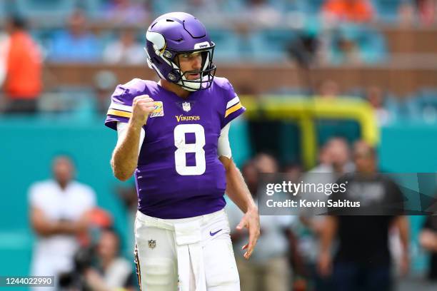 Kirk Cousins of the Minnesota Vikings celebrates after throwing a touchdown pass during the second quarter of an NFL football game against the Miami...