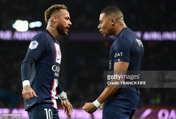 Paris Saint-Germain's Brazilian forward Neymar celebrates after opening the scoring with Paris Saint-Germain's French forward Kylian Mbappe during...