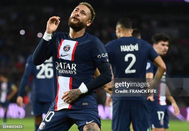 Paris Saint-Germain's Brazilian forward Neymar celebrates after opening the scoring during the French L1 football match between Paris Saint-Germain...