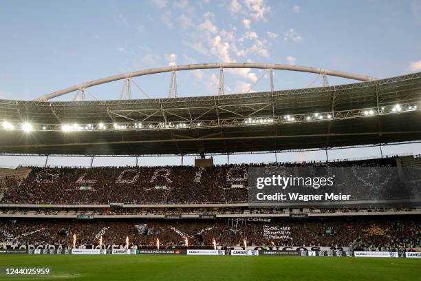 Botafogo fans cheer for their team during a match between Botafogo and Internacional as part of Brasileirao 2022 at Estadio Olimpico Nilton Santos on...