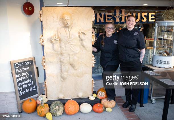 Creators Hannalee Pervan and Catherine Pervan stand for a photo in front of their creation "Pan Solo", a 6-foot tall replica made entirely of bread,...