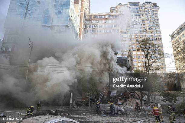 Firefighters conduct work in a destroyed building after Russian attacks in Kyiv, Ukraine on October 17, 2022. It was reported that two separate...