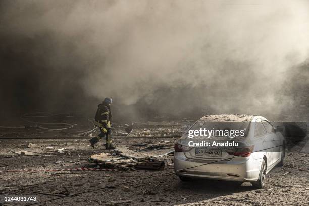 Firefighters conduct work after the Russian drone attacks in Kyiv, Ukraine on October 17, 2022. At least 4 separate explosions were heard in Kyiv,...