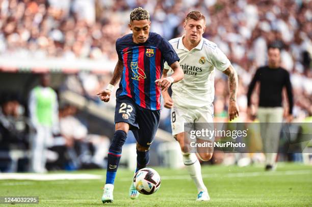 Raphinha and Toni Kroos during La Liga match between Real Madrid CF and FC Barcelona at Estadio Santiago Bernabeu on October 16, 2022 in Madrid,...