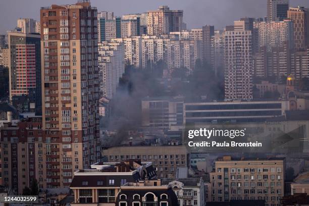 Smoke rises as Ukraine's capital is rocked by explosions during a drone attack in the early morning on October 17, 2022 in Kyiv, Ukraine. The...
