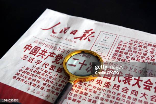 Citizen reads a newspaper to learn about the report of the 20th Communist Party of China Congress in Shenyang, Liaoning province, China, Oct 17, 2022.