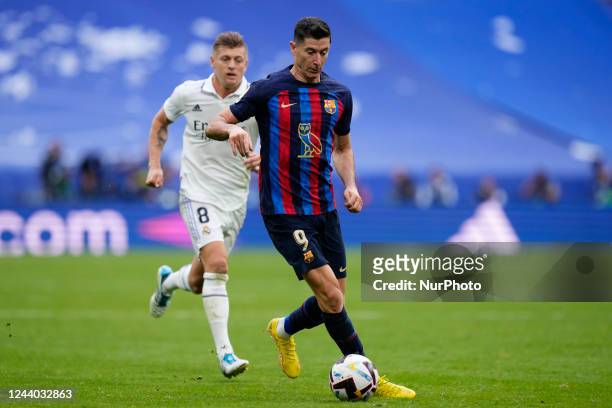 Robert Lewandowski centre-forward of Barcelona and Poland and Toni Kroos central midfield of Real Madrid and Germany compete for the ball during the...