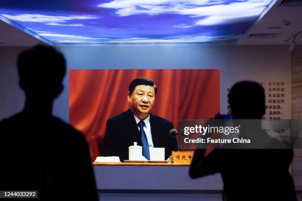 People tour an exhibition of the third National Congress of the Communist Party of China in Guangzhou in south China's Guangdong province Saturday,...