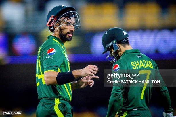 Pakistan's Pakistan's Shan Masood talks with Shadab Khan between the overs during the Australia 2022 Twenty20 World Cup cricket warm-up match between...