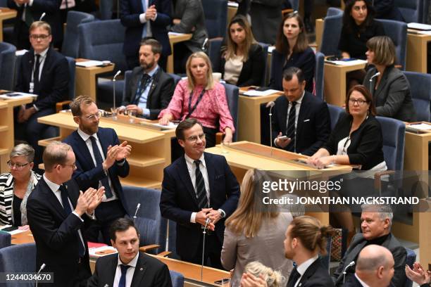 The leader of Sweden's Moderate Party and newly elected Prime Minister Ulf Kristersson reacts during an applause from his Party after the voting at...