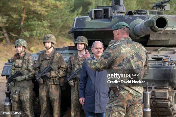 Chancellor Olaf Scholz during a visit at the Bundeswehr army training center in Ostenholz on October 17, 2022 near Hodenhagen, Germany. Scholz has...